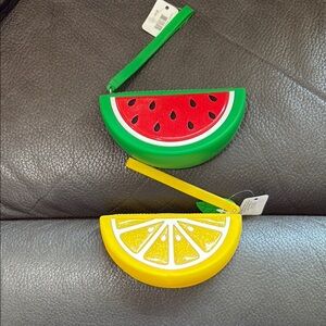 Two bath and body fruit cases with strap in watermelon and lemon
